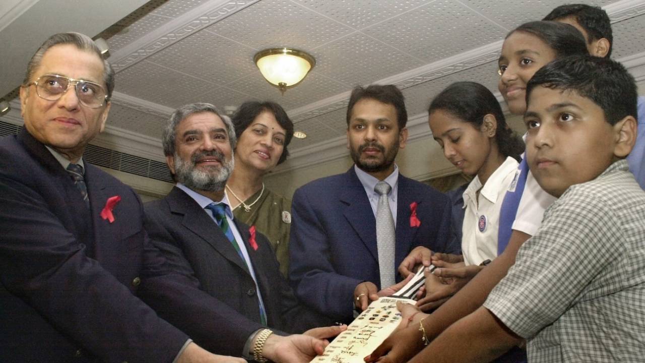 BCCI president Jagmohan Dalmiya (first at left) and ICC president Ehsan Mani (second from left)  present a cricket bat signed by the Indian cricket team to a United Nations Programme on HIV-AIDS (UNAID) functionary, Cricket Club of India,Mumbai, September 18 2003