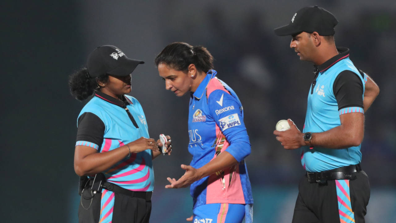 Mumbai Indians captain Harmanpreet Kaur in conversation with umpire N Janani about the Shikha Pandey not-out run-out incident. Umpire Anish Sahasrabudhe listens in, Mumbai Indians vs Delhi Capitals, WPL 2025, Vadodara, February 15, 2025