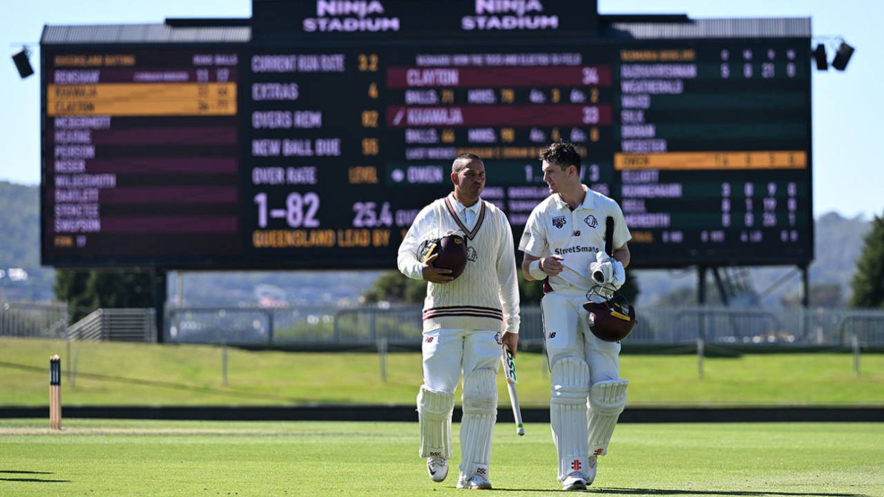 Usman Khawaja and Jack Clayton walk off after completing victory, Queensland vs Tasmania, Sheffield Shield, Hobart, March 9, 2025