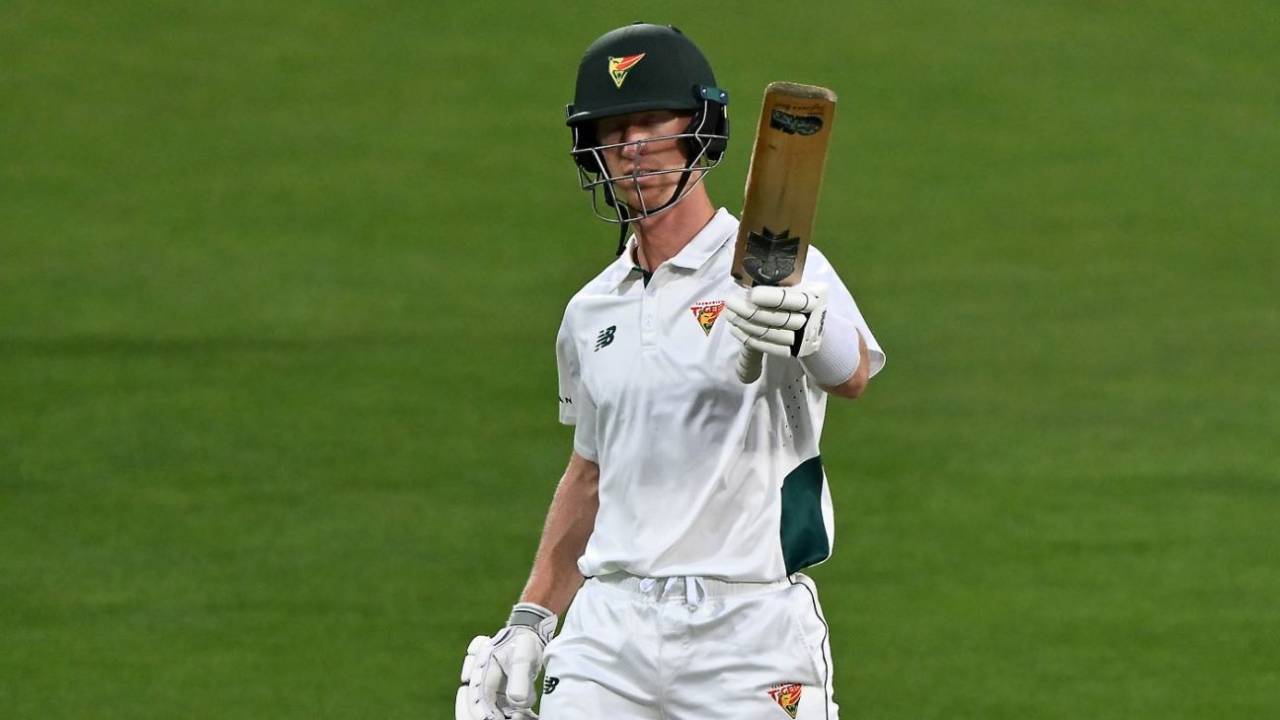 Jordan Silk raises his bat in his 100th Sheffield Shield match, Tasmania vs New South Wales, Sheffield Shield, Hobart, March 15, 2025