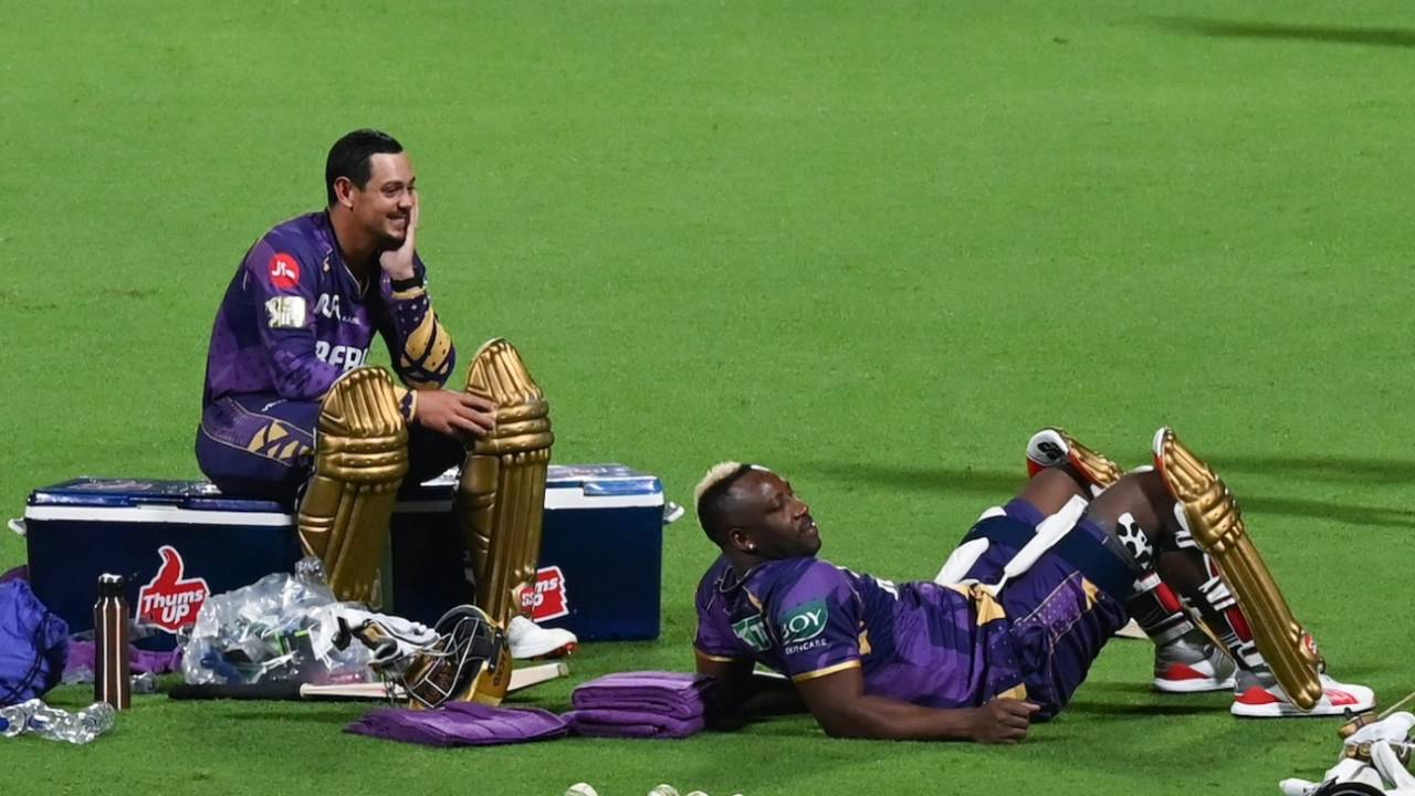 Quinton de Kock and Andre Russell take a break during a training session, Kolkata Knight Riders vs Royal Challengers Bengaluru, IPL 2025, Kolkata, March 20, 2025