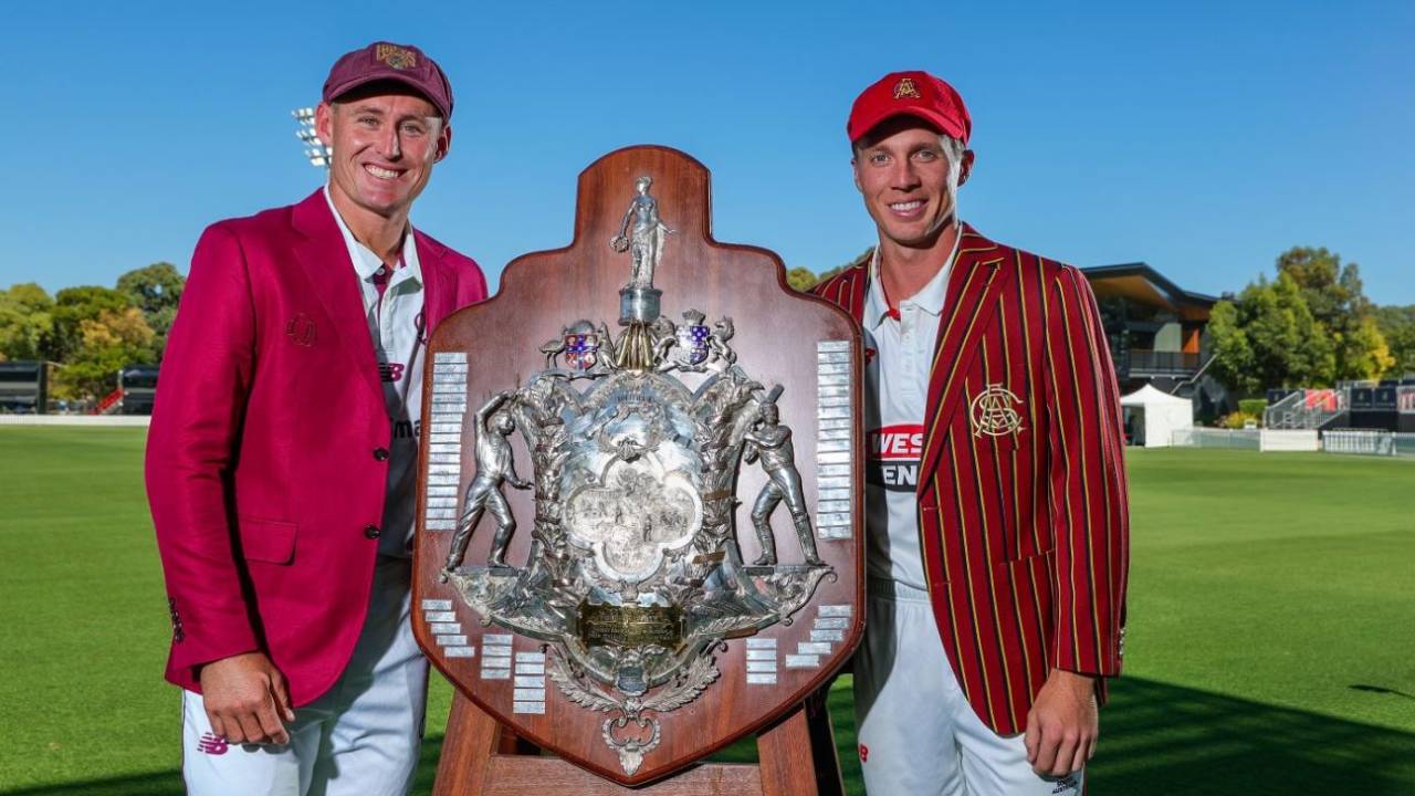 Queensland captain Marnus Labuschagne and South Australia captain Nathan McSweeney pose with the Sheffield Shield trophy