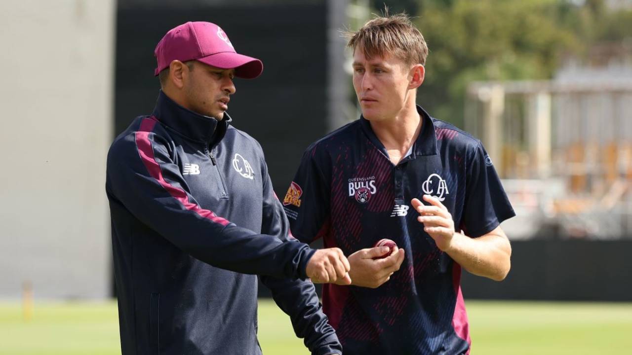 Usman Khawaja and Marnus Labuschagne chat at training