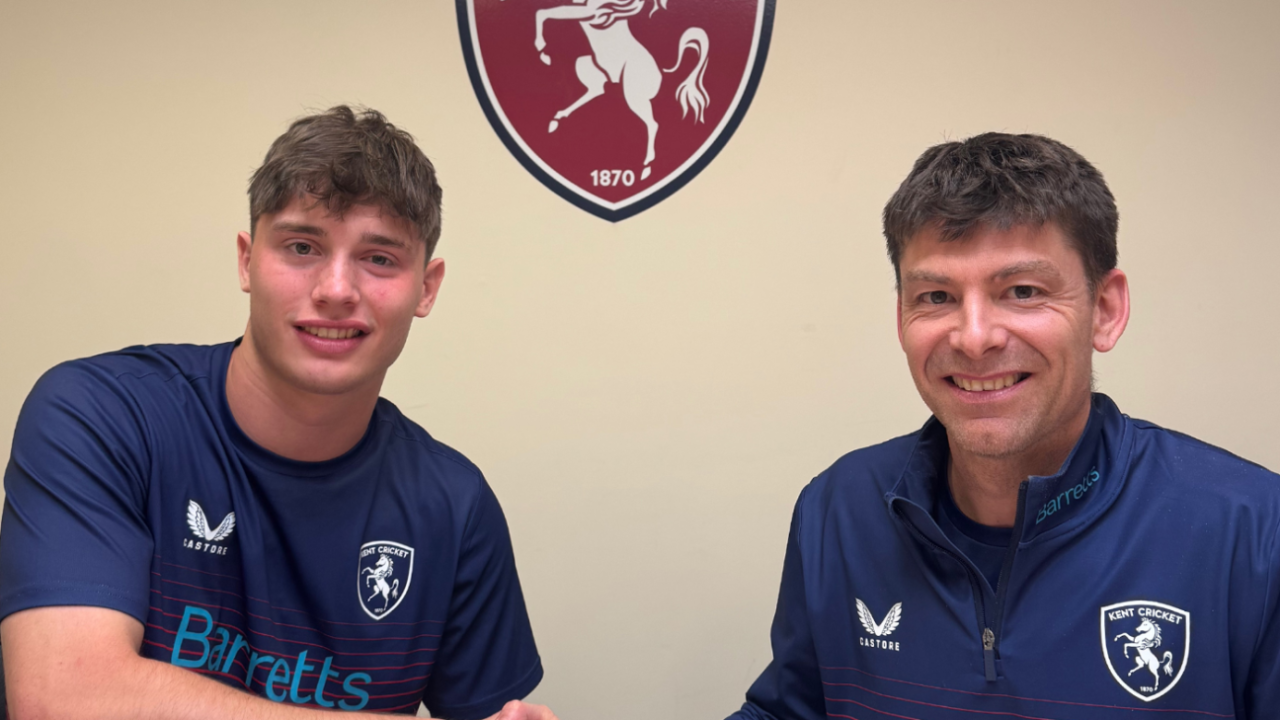 Corey Flintoff shakes hands with Kent's director of cricket, Simon Cook, after signing a rookie deal, March 31, 2025