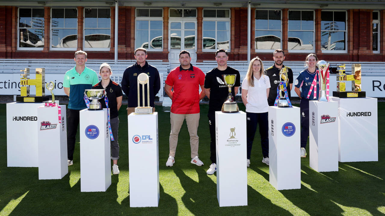 Sam Billings, Lucy Higham, Dan Douthwaite, Anthony Clapham, Rory Burns, Emily Windsor, Jack Taylor and Saskia Horley pose with the domestic trophies at the ECB's season launch, Lord's, April 1, 2025