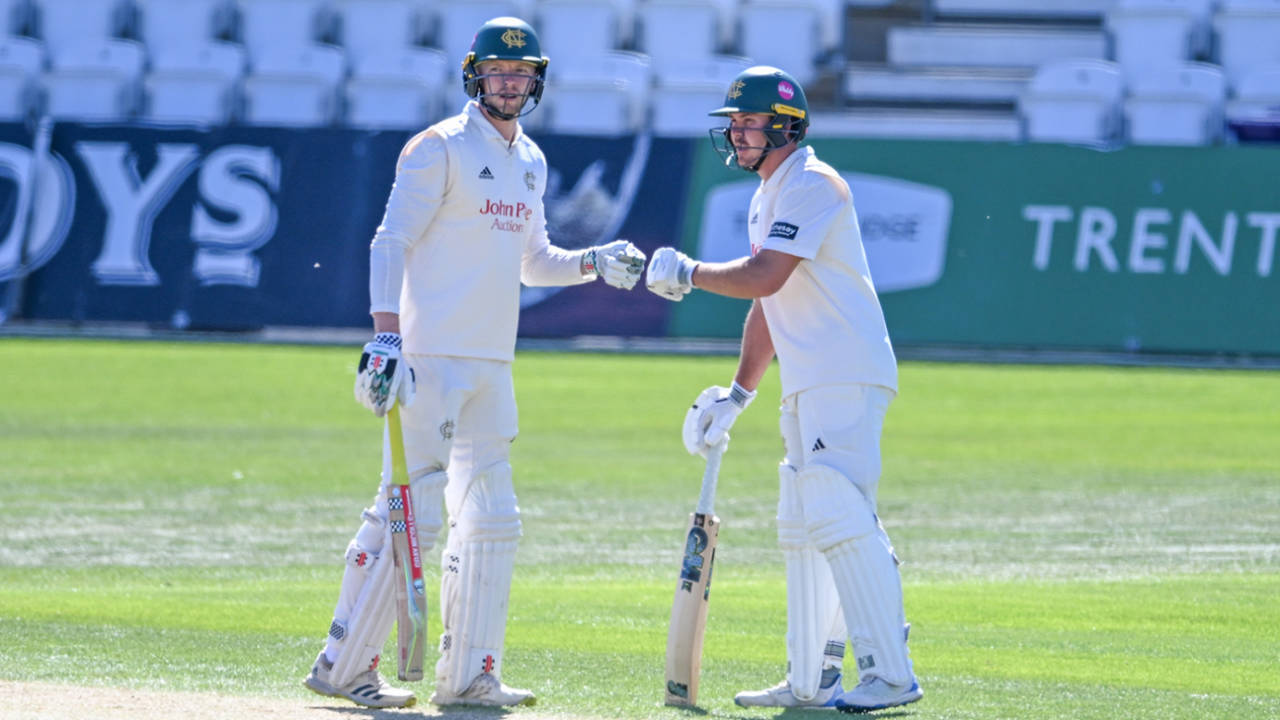 Lyndon James touches gloves with Matt Montgomery during their 118-run partnership for the seventh wicket, Nottinghamshire vs Durham, County Championship Division One, Trent Bridge, April 6, 2025