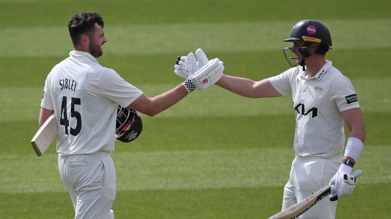 Dom Sibley gets congratulations from Jamie Smith after his second hundred of the match, Surrey vs Hampshire, County Championship, Kia Oval, April 13, 2025