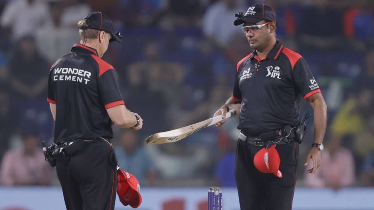 Umpires Vinod Seshan and Chris Gaffaney check the size of a bat during Delhi Capitals vs Mumbai Indians game, DC vs MI, IPL 2025, Delhi, April 13, 2025