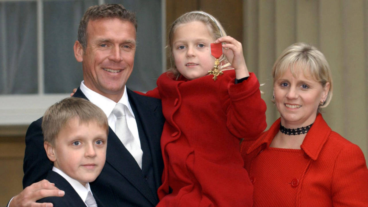 Alec Stewart stands with his wife Lynn and children Andrew, 10, and Emily, 7, after receiving his OBE, Buckingham Palace, London, December 5, 2003.
