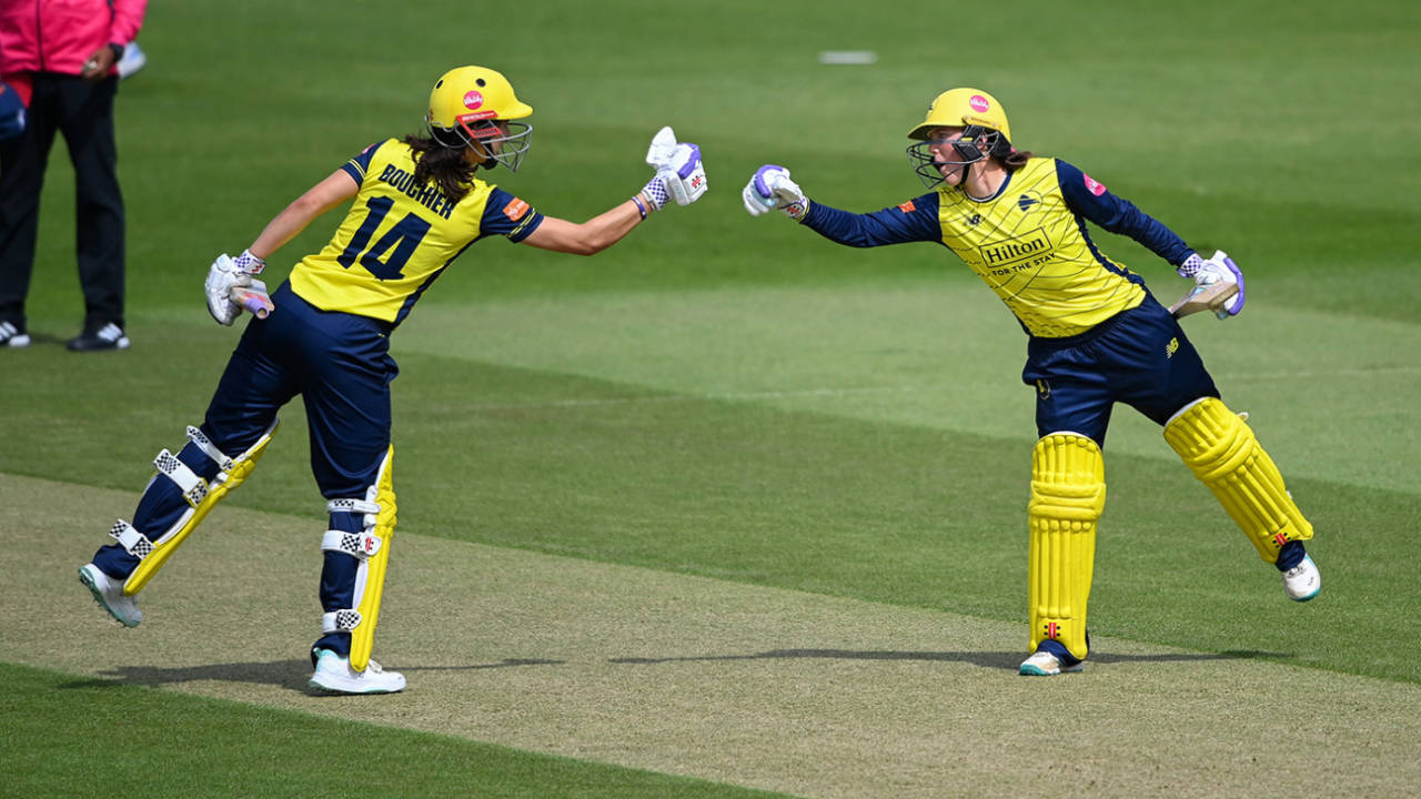 Maia Bouchier and Ella McCaughan punch gloves during their stand, Hampshire vs Essex, Women's T20 Blast, Utilita Bowl, May 30, 2025