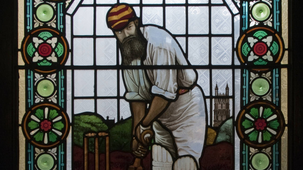 A stained-glass window depicting cricketer WG Grace in the Champion public house in Wells Street, Marylebone, 