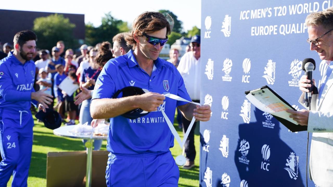 Joe Burns, the Italy captain, admires his medal, Italy vs Netherlands, ICC Men's T20 World Cup Europe Region Final, The Hague, July 11, 2025