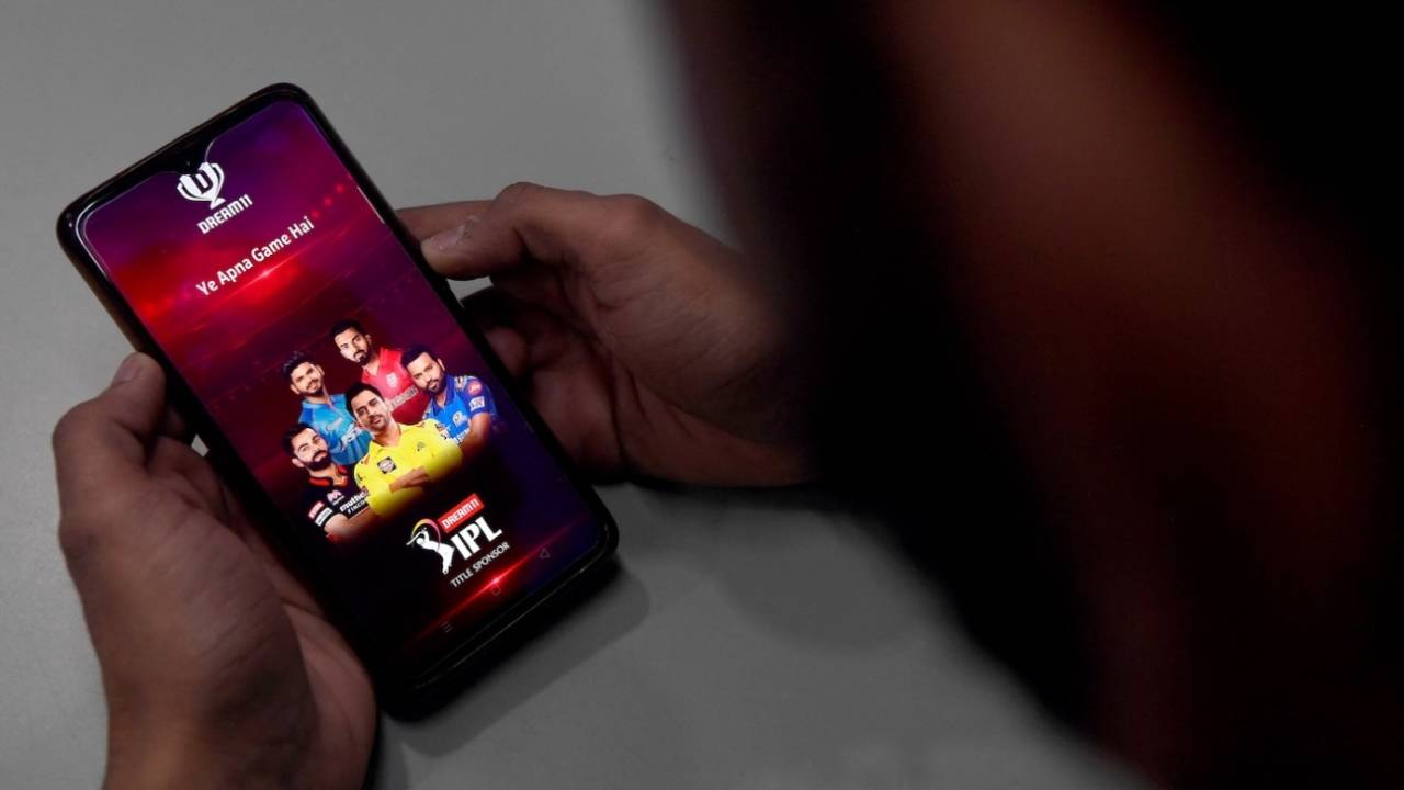 A user checks the Dream11 app on his phone, New Delhi, October 12, 2020
