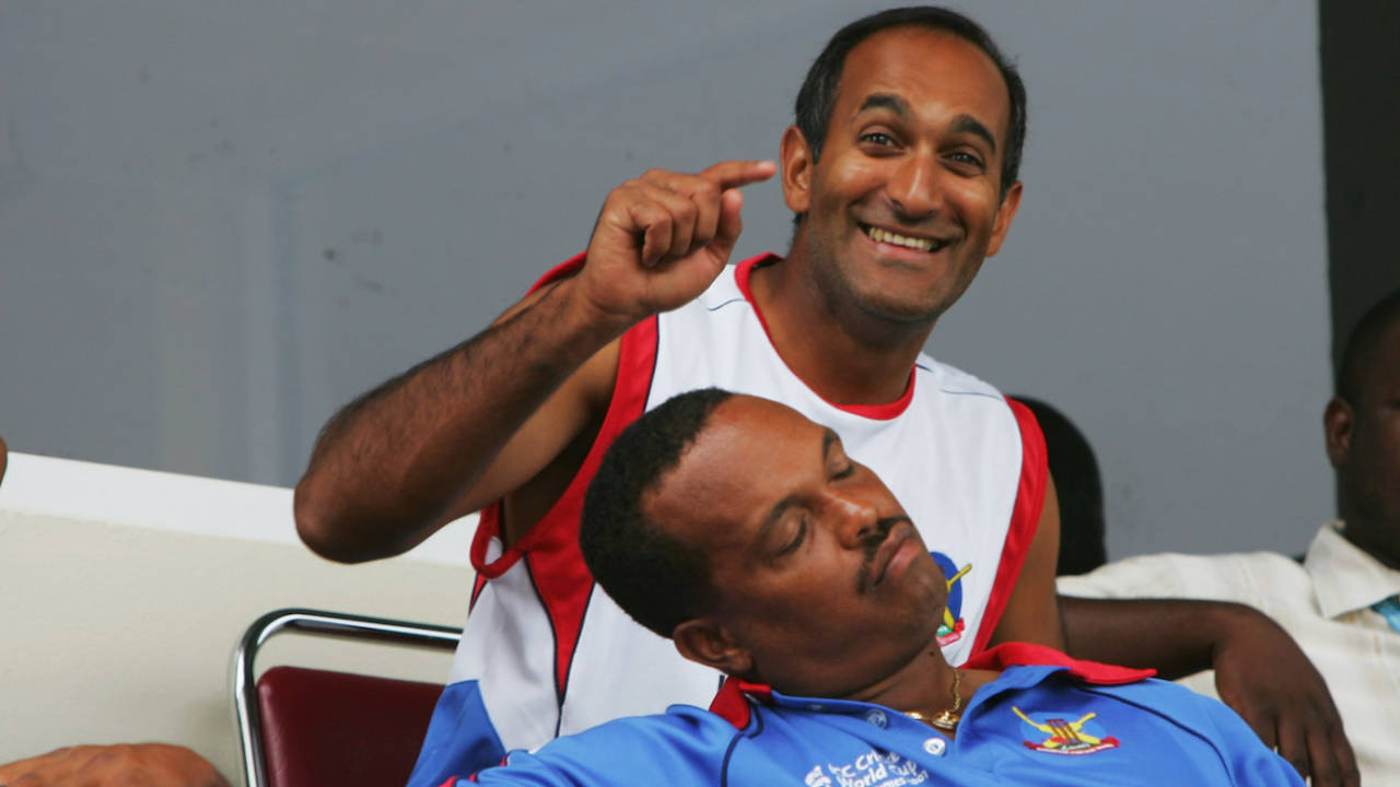 Saleem Mukuddem is deeply amused at team-mate Clay Smith falling asleep waiting for the match to start , Trinidad, March 25, 2007