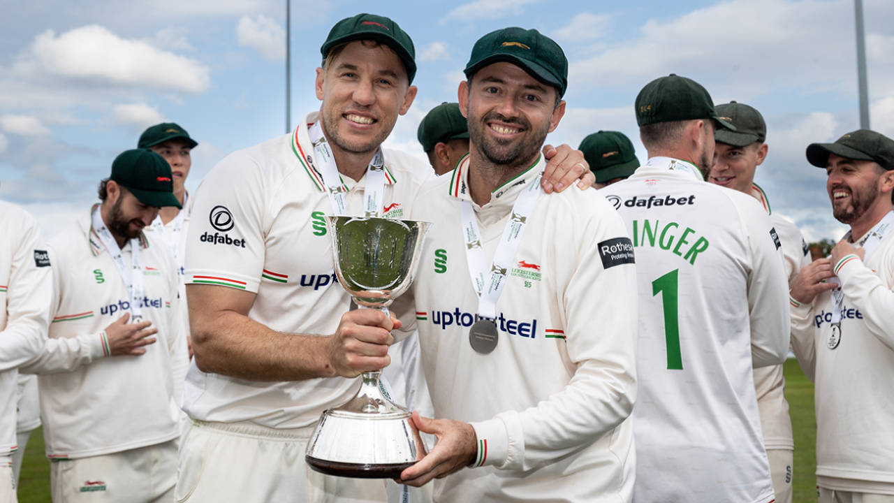 Logan van Beek and Leicestershire captain Ian Holland pose with the trophy, Northamptonshire vs Leicestershire, County Championship, Wantage Road, September 27, 2025