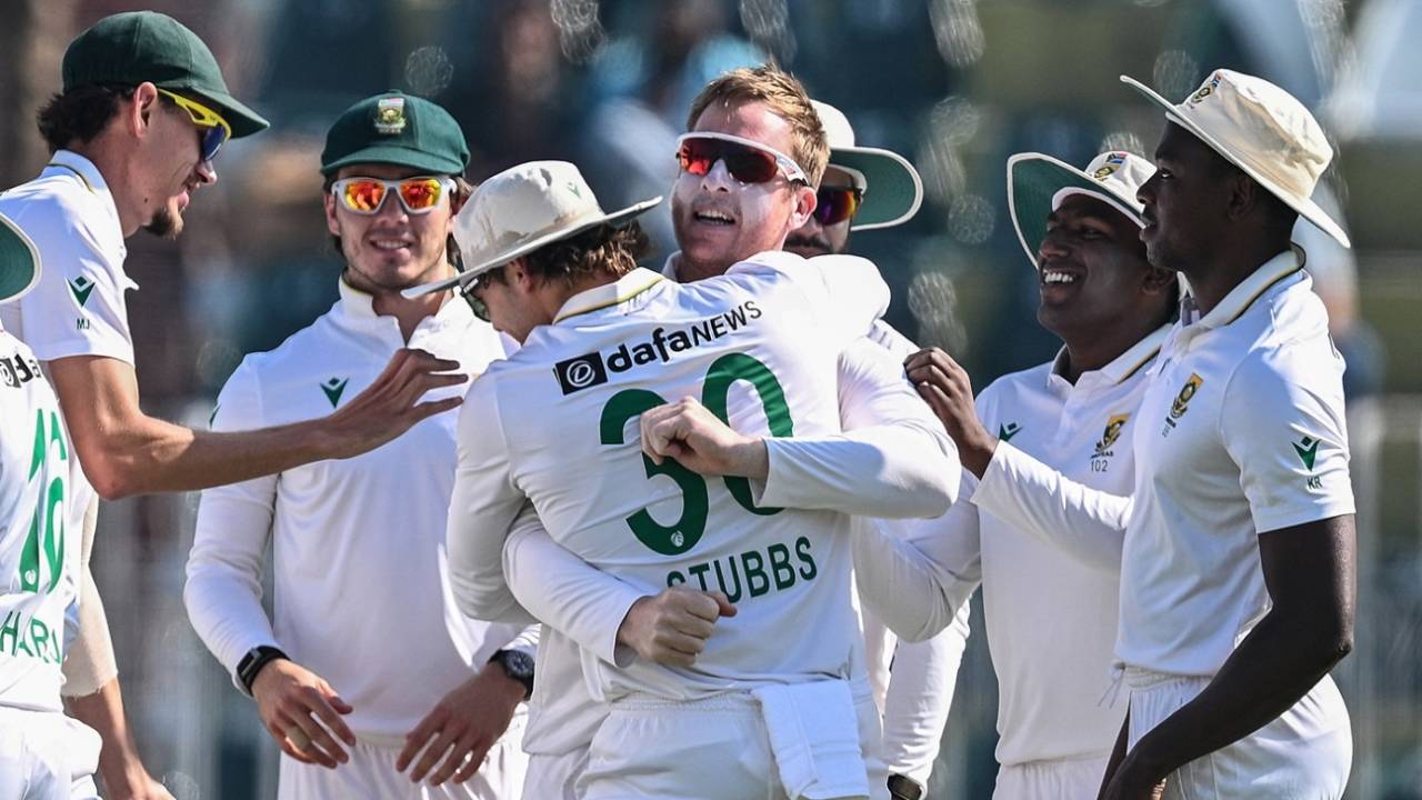 Simon Harmer is swamped by his team-mates after completing his maiden Test five-for, Pakistan vs South Africa, 2nd Test, Rawalpindi, 4th day, October 23, 2025