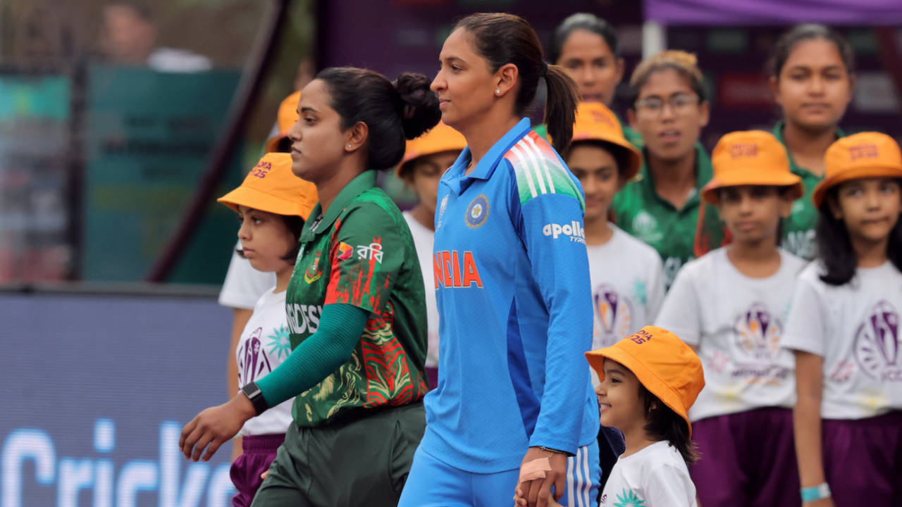 Nigar Sultana, Harmanpreet Kaur (and a happy-go-lucky mascot) walk out for the anthems, India vs Bangladesh, Women's World Cup 2025, Navi Mumbai, October 26, 2025