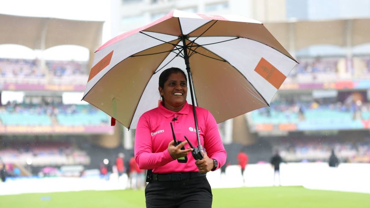 Fourth umpire Nimali Perera in the middle with an umbrella, India vs South Africa, Women's World Cup, Final, Navi Mumbai, November 2, 2025