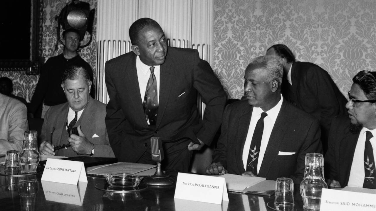 Sir Learie Constantine, Commissioner for the Trinidad and Tobago Government Office taking his seat at a conference, London, May 28, 1962 