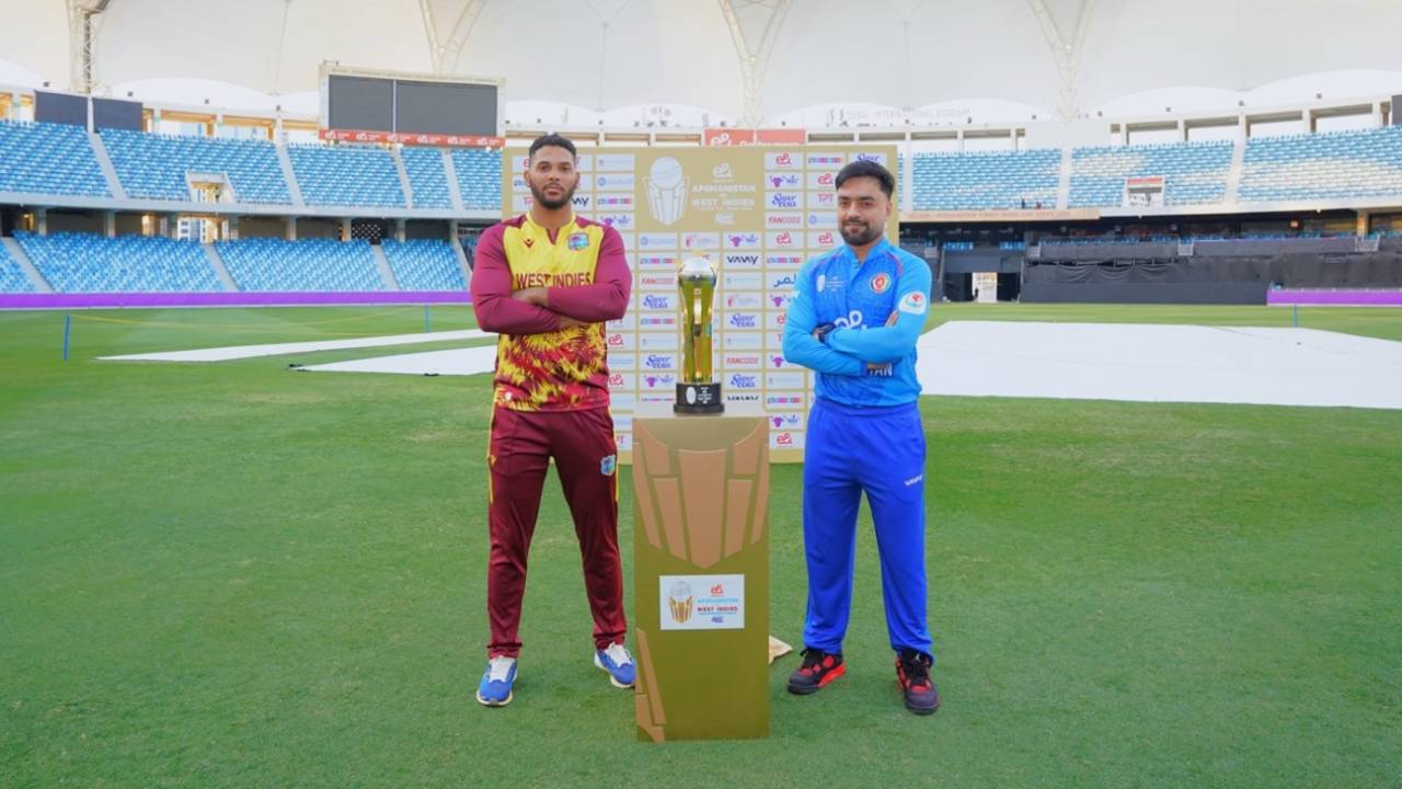 Brandon King and Rashid Khan pose with the T20I series trophy, Dubai, January 18, 2026
