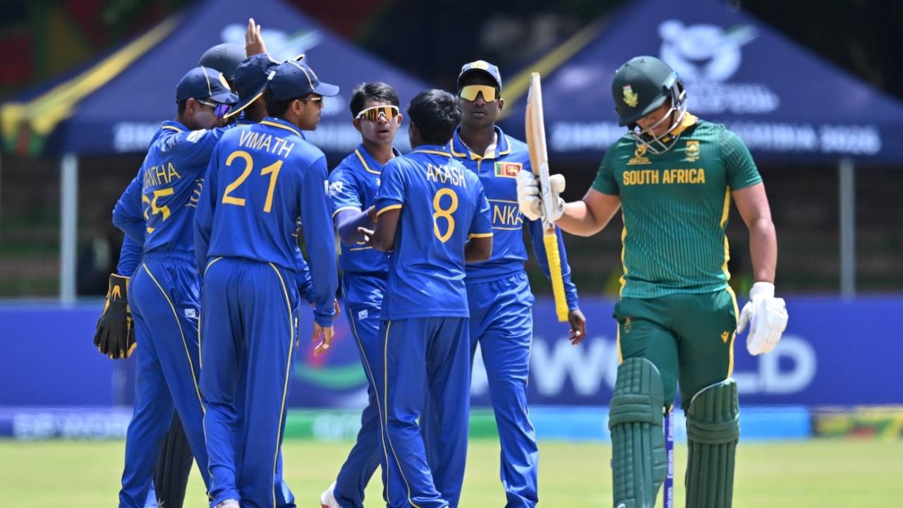 Akash Vigneswaran celebrates a wicket with his team-mates