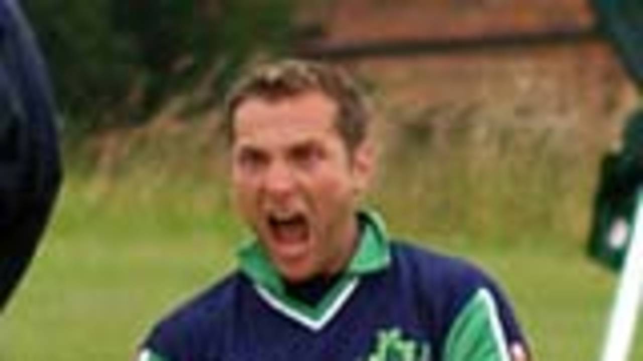 Ireland's Gordon Cooke celebrates a wicket