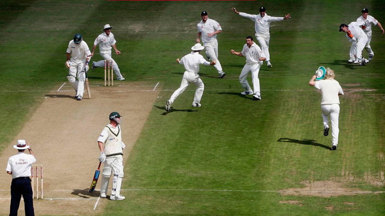 England's players mob Steve Harmison after he took the final wicket in dramatic style, England v Australia, Edgbaston, August 7, 2005