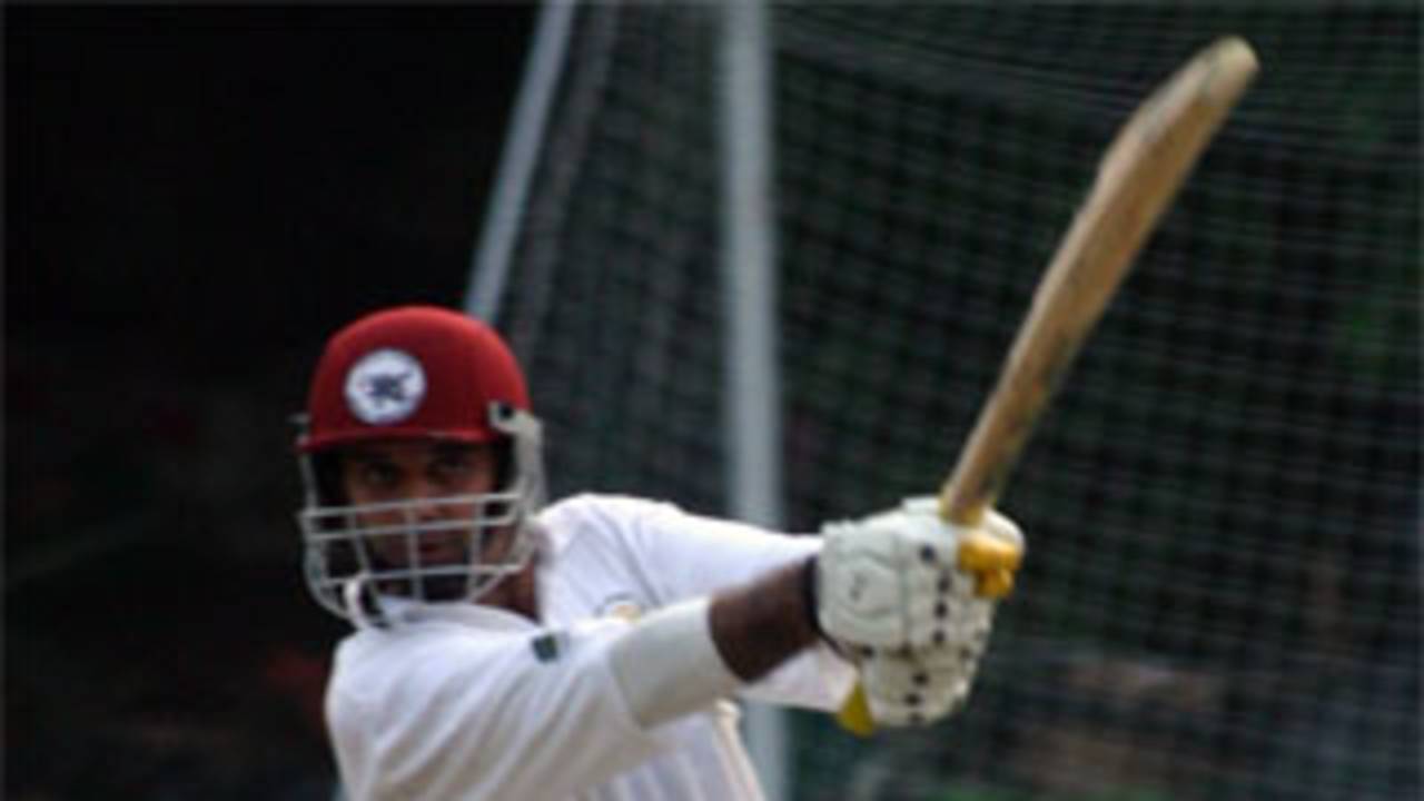 Ravi Sujanani crashes the ball to the boundary for KCC against RLCCC during a match marking Kowloon Cricket Club's centenary