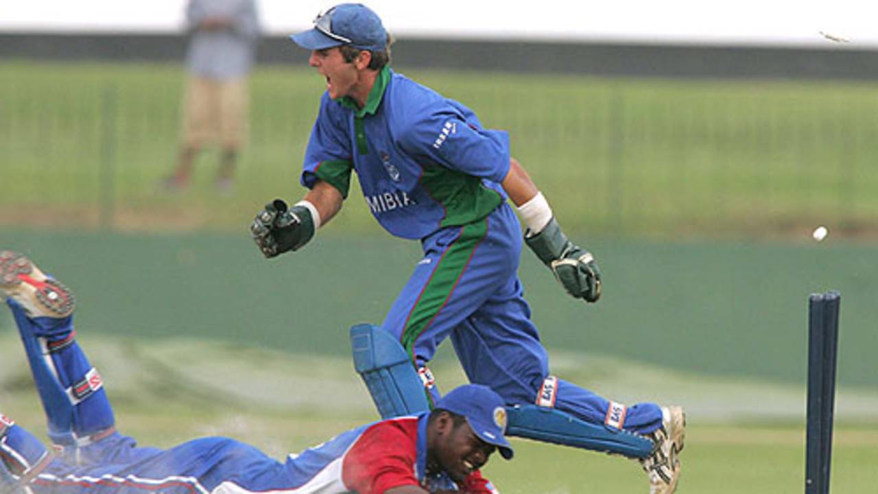 Romeno Deane of the USA is run out as Namibias Ewald Steenkamp celebrates.  The USA eventually won the Plate Championship quarter-final in the ICC U19 Cricket World Cup by two wickets in Colombo on Tuesday, their first-ever win in the tournament. February 14, 2005