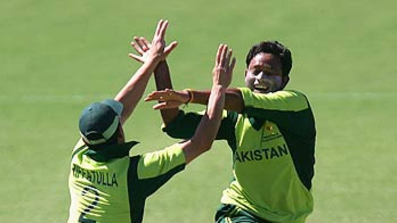 Rafatullah Mohmand and Wasim Khan celebrate the fall of Michael Papps, New Zealand A v Pakistan A, Top End Series, Darwin, July 9, 2006