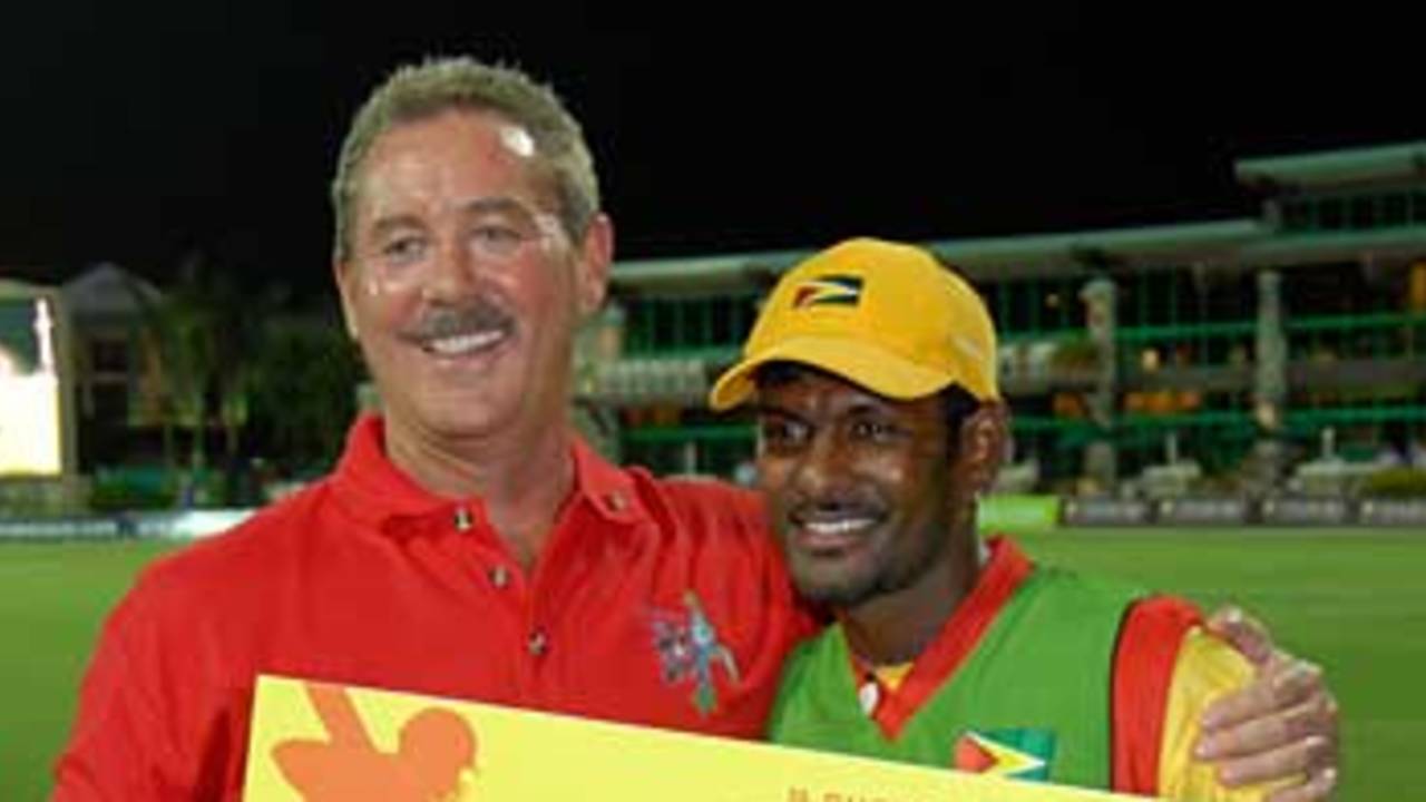 In the money... Mahendra Nagamootoo accepts the Man of the Match award cheque from Allen Stanford, Grenada v Guyana, Stanford 20/20, 1st semi-final, 10 August 2006

