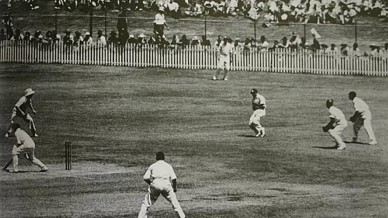Jack Ikin 'catches' Don Bradman in one of the Ashes' most controversial moments. The umpire ruled Bradman not out, to the dismay of the fielders, Australia v England, 1st Test, Brisbane, November 29, 1946