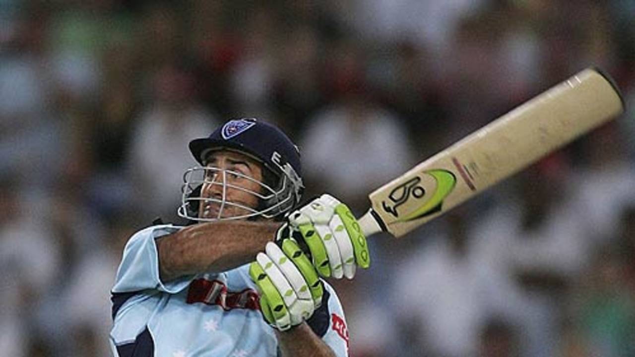 Andrew Johns swats a ball over the slips
