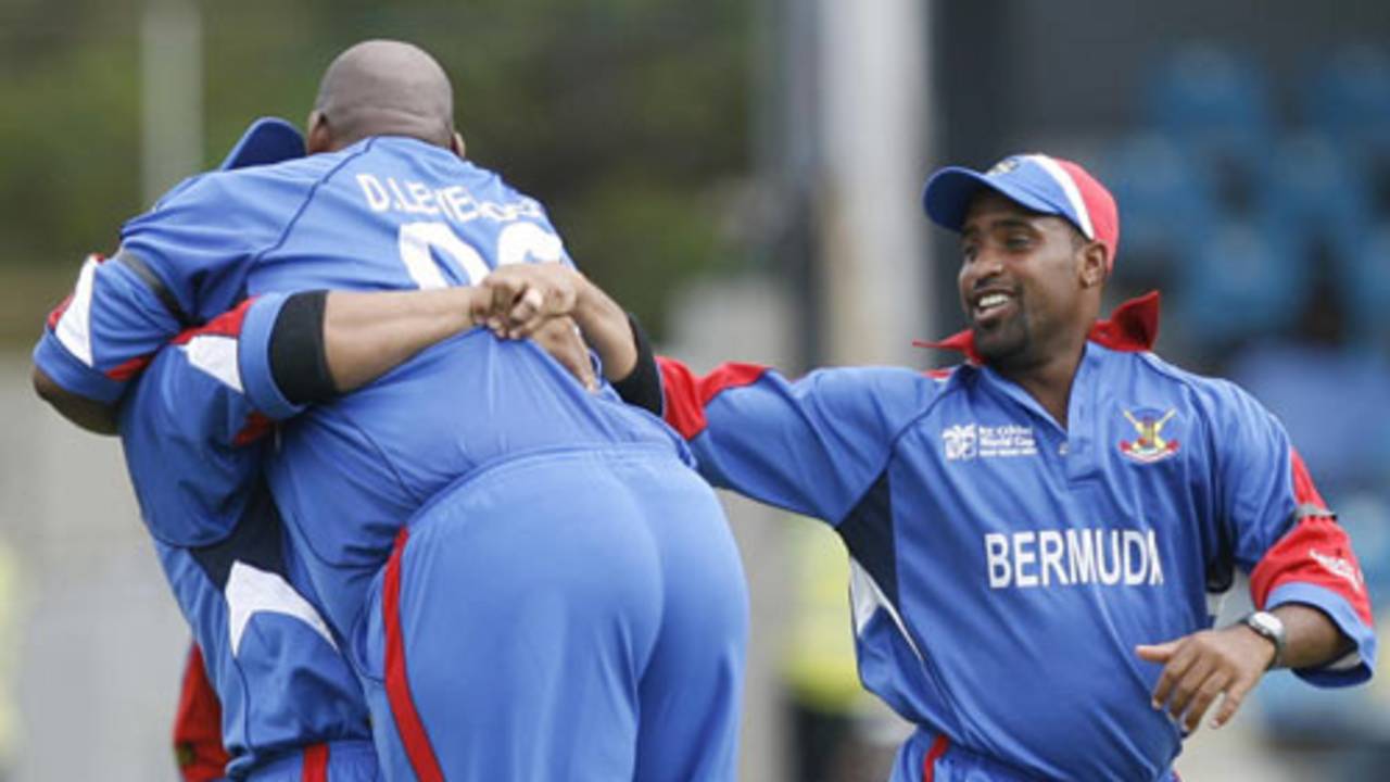 Dwayne Leverock is lifted off his feet by Irvine Romaine as Kwame Tuckerlooks on after a stunning one-handed catch to dismiss Robin Uthappa, Bermuda v India, Group B, Trinidad, March 19, 2007