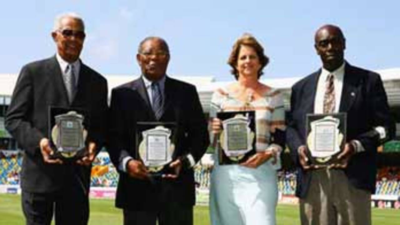 Sir Garfield Sobers, Sir Everton Weekes, Kathryn Ward (daughter of Denis Atkinson) and Denis Depeiaza (son of Clairmonte Depeiaza) receive awards as West Indies cricket record holders