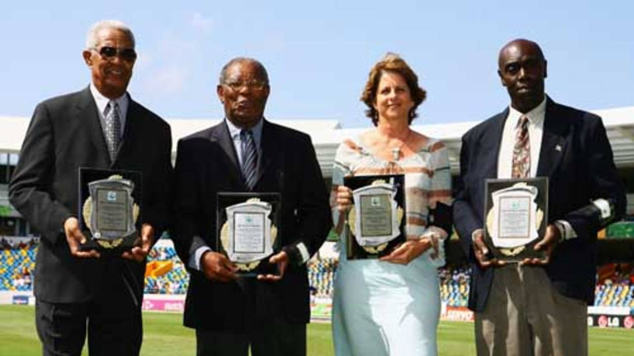 Sir Garfield Sobers, Sir Everton Weekes, Kathryn Ward (for her father Denis Atkinson) and Denis Depeiaza (for his father Clairmonte Depeiaza) receive awards as West Indies cricket record holders
