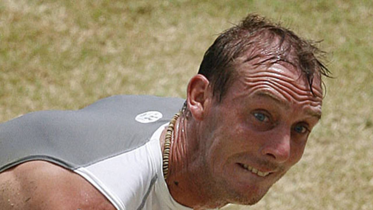 Paul Mooney, with a bloody arm, roars into bowl during a net session, Guyana, April 8, 2007