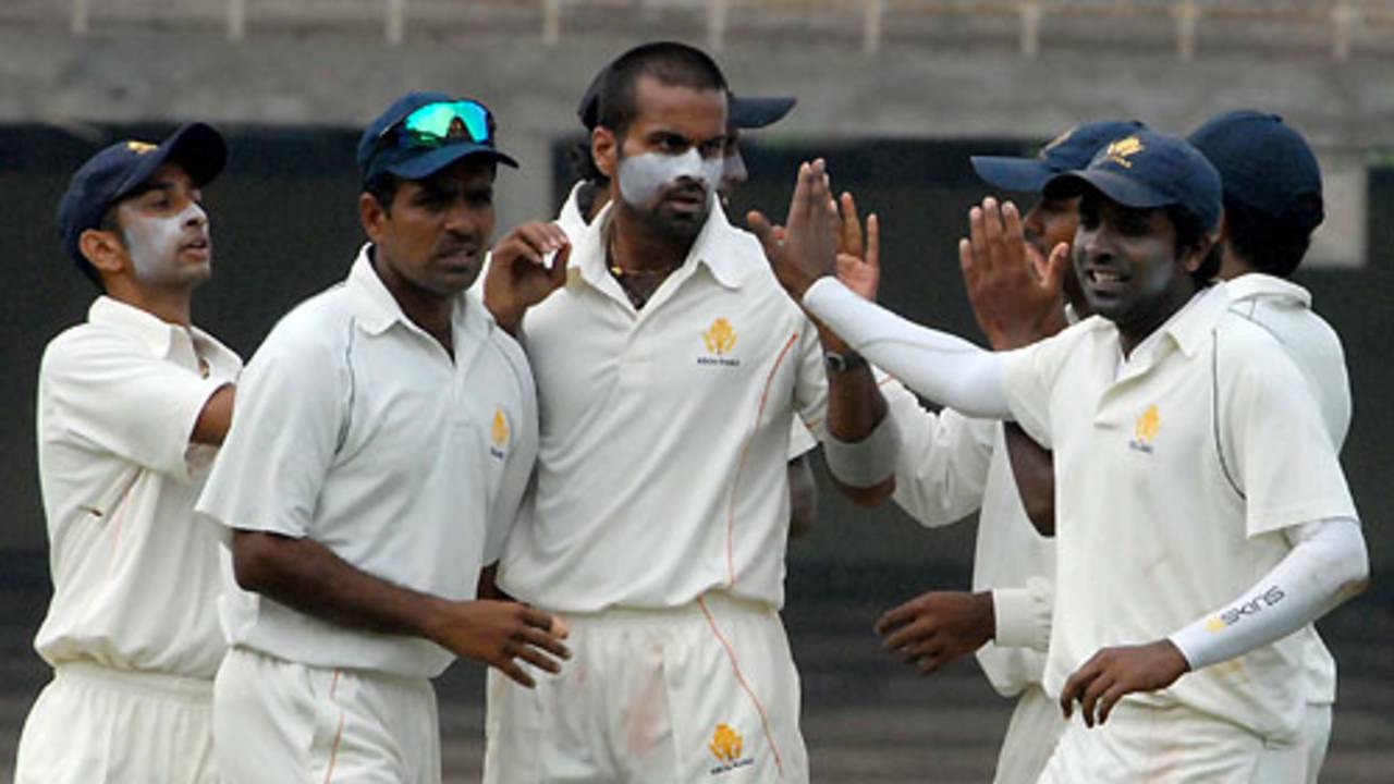 NC Aiyappa and his team-mates celebrate the fall of M Vijay for 32