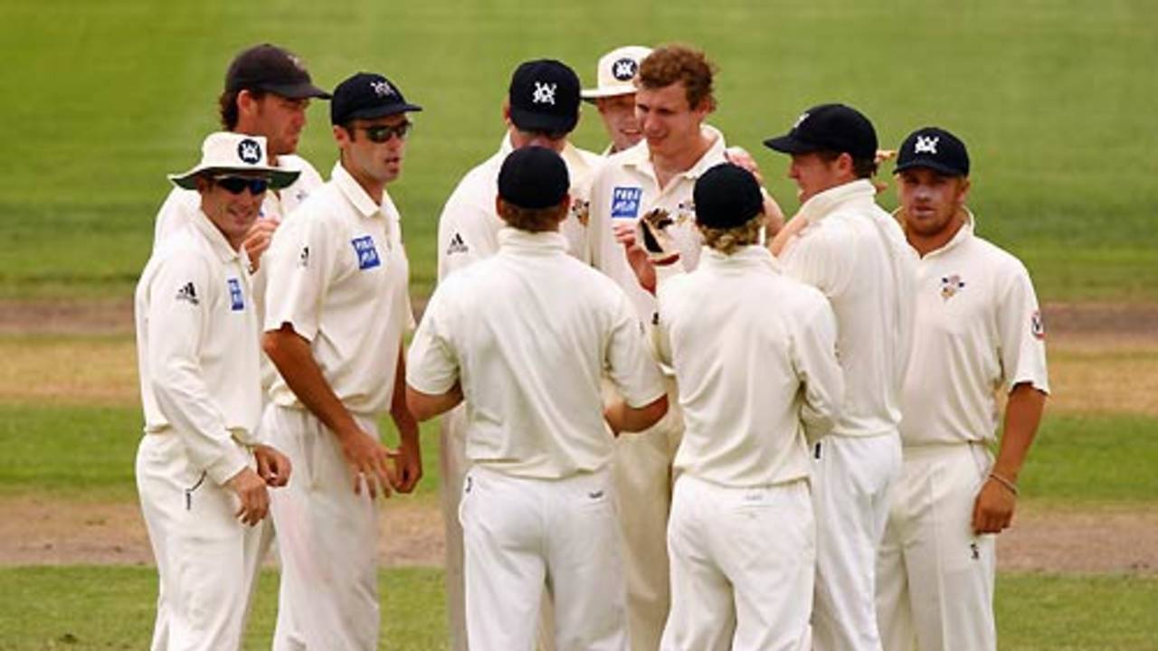 Victoria gather around Allan Wise after getting rid of Sourav Ganguly