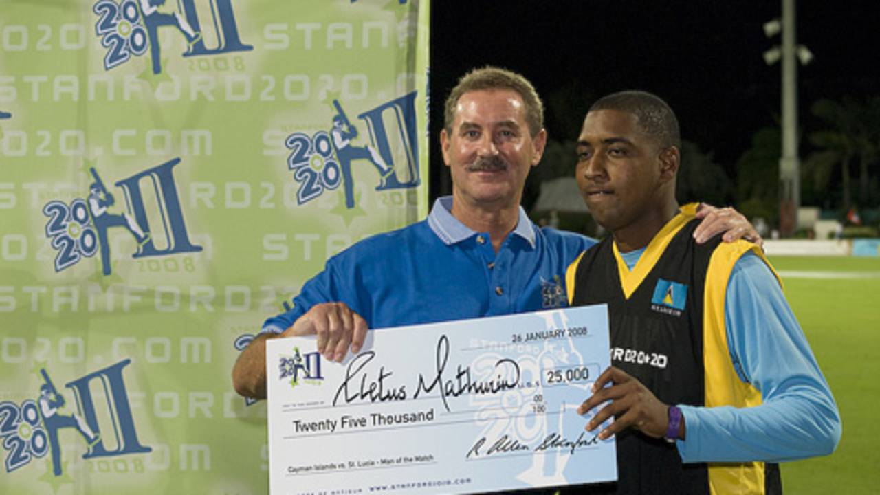 Man-of-the-Match Cletus Mathurin receives his US$25,000 prize money from Allen Stanford 