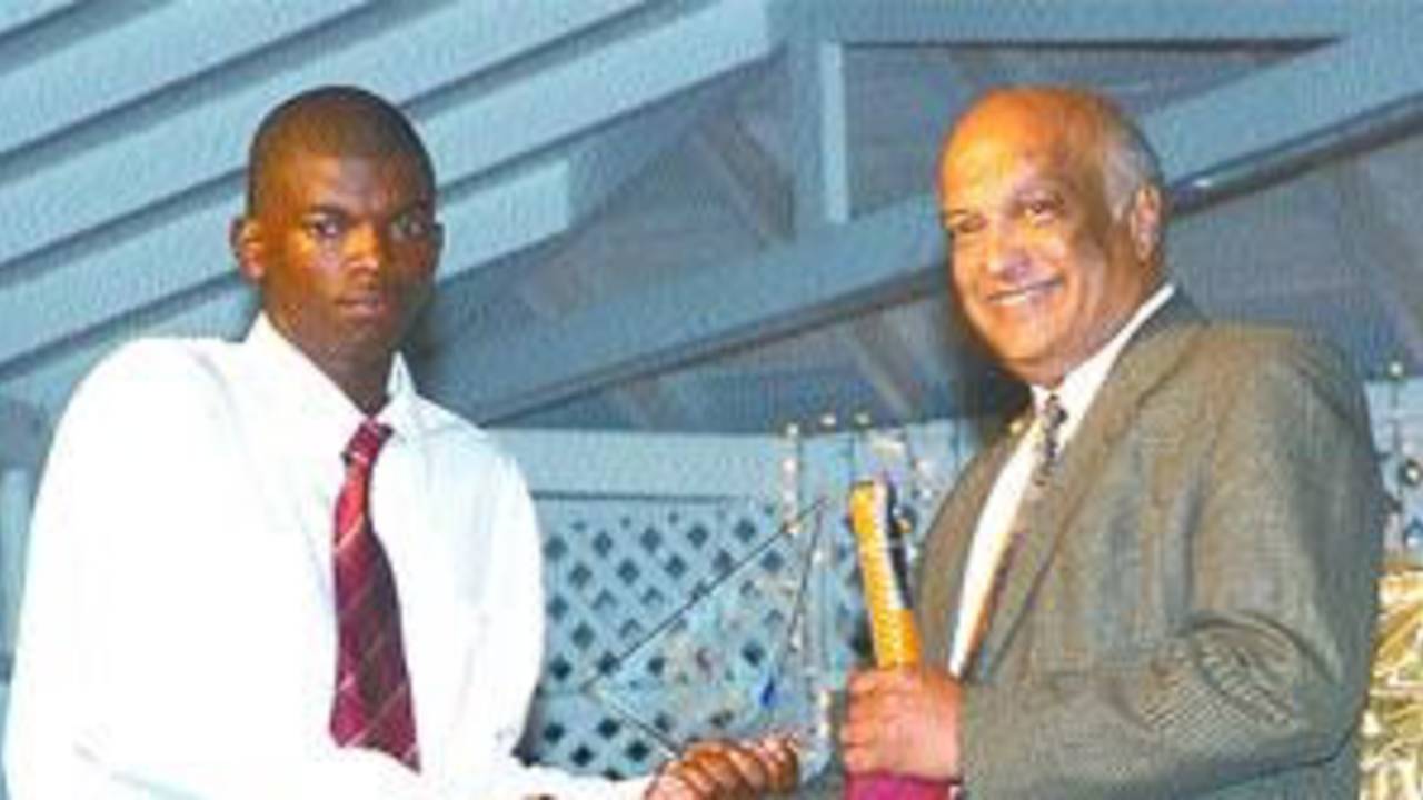 Ramon Senior receives the best bowler prize for his 11 wickets in the CLICO International Under-15 tournament