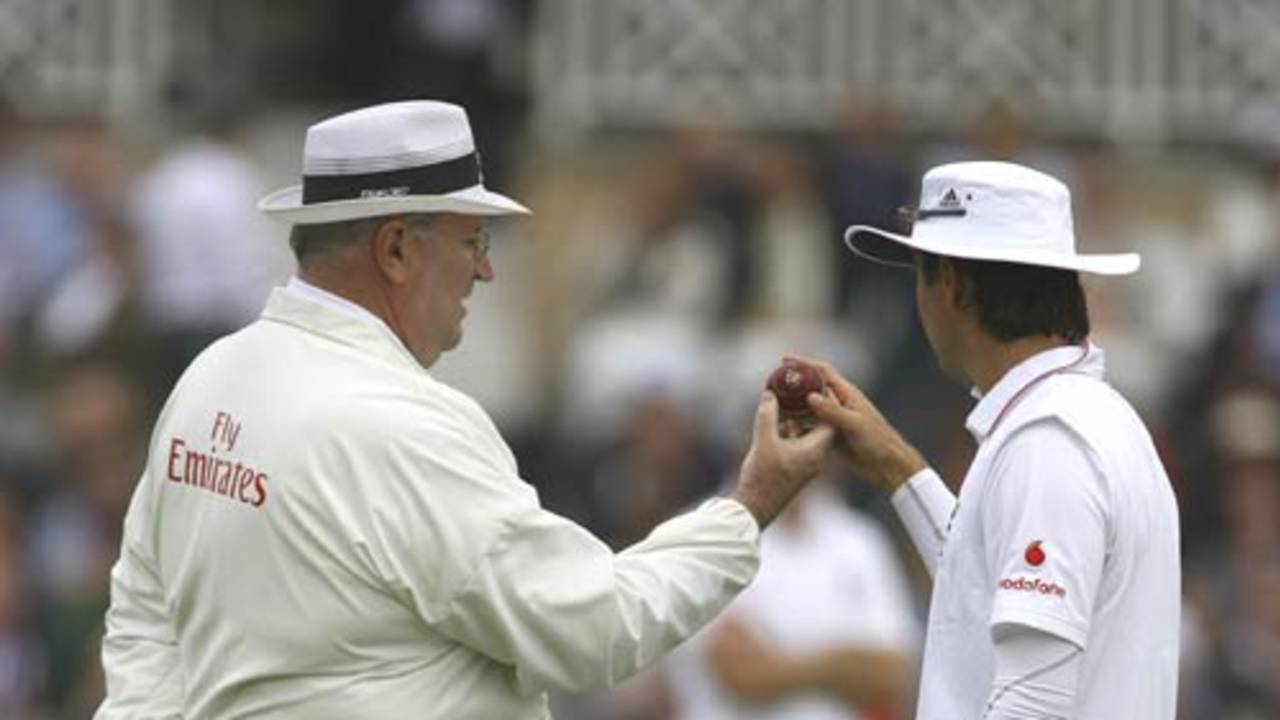 Michael Vaughan and Darrell Hair inspect the ball
