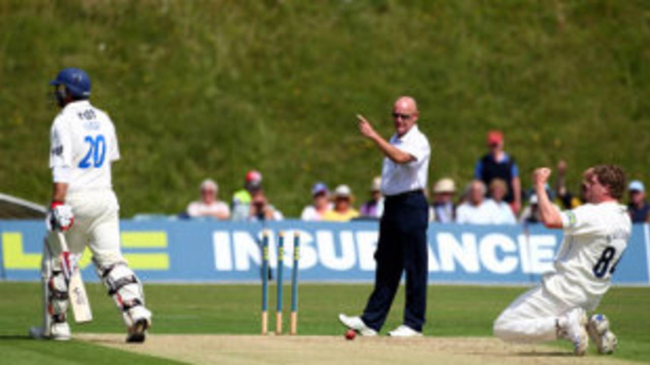 Jeff Evans raises his finger as David Balcombe celebrates running out non-striker Michael Yardy of Sussex after deflecting a full blooded drive from Chris Nash onto the stumps, Sussex v Hampshire, Arundel, July 16, 2008