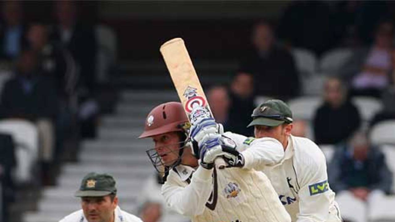 Lee Hodgson drives during his half-century on debut for Surrey