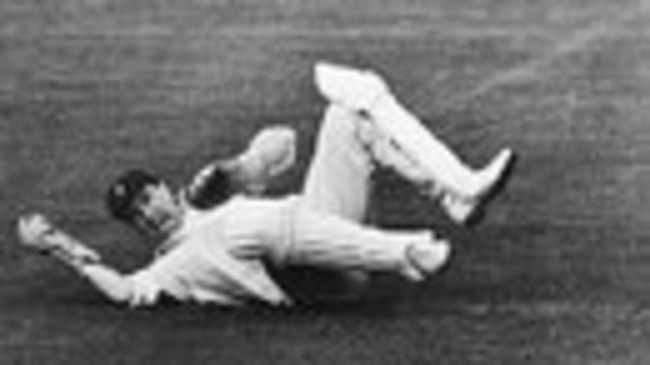 George Dawkes dives for a catch, 1956
