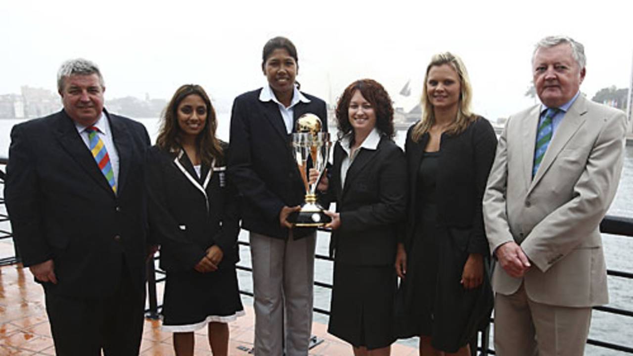 Jack Clarke, Isa Guha, Jhulan Goswami, Karen Rolton, Suzie Bates and David Morgan with the World Cup trophy
