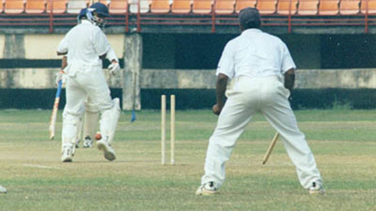 S Mahesh sends Sreekumar Nair's leg stump cart wheeling. Ranji Trophy South Zone League, 2000/01, Kerala v Tamil Nadu, Nehru Stadium, Kochi, 29Nov-02Dec 2000.