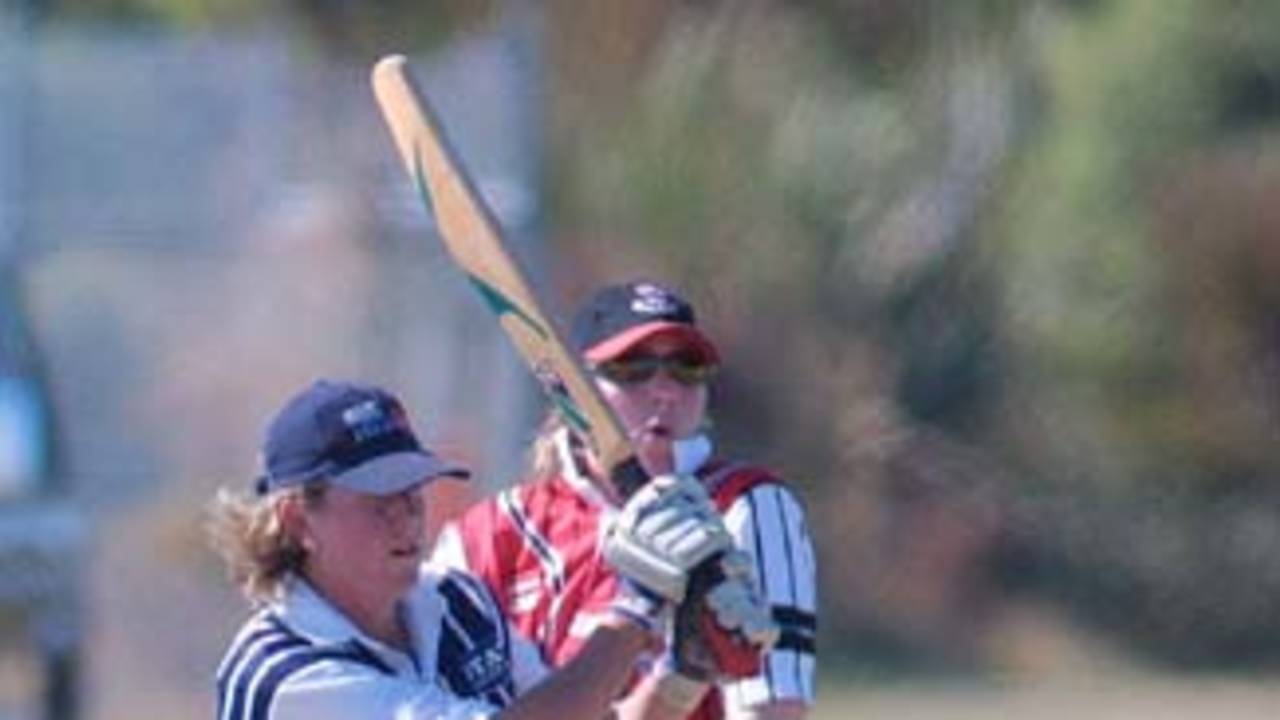 Auckland opening batsman Shelly Fruin swings a ball away through forward square leg during her innings of 97 while Canterbury wicket-keeper Jo Strachan looks on. State Insurance Cup Final: Canterbury Women v Auckland Women at Village Green, Christchurch, 10 February 2001.