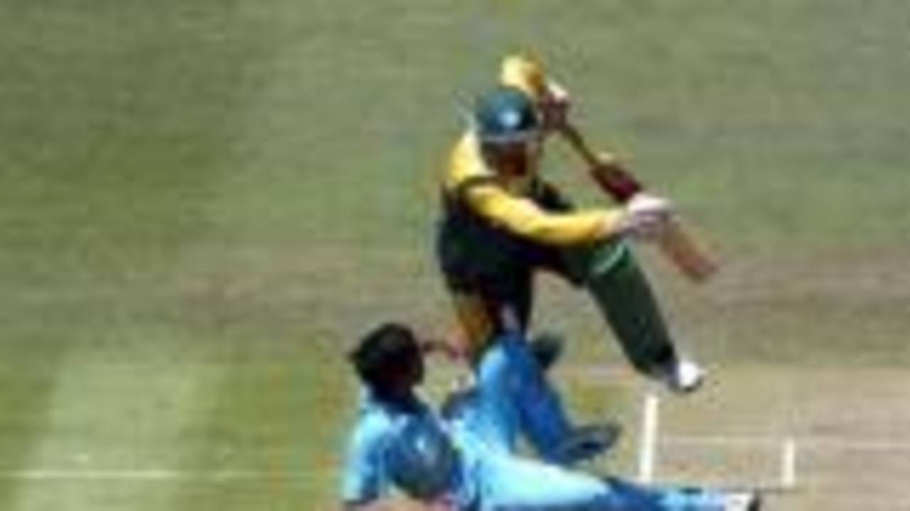 South Africa Under-19 batsman Hashim Amla collides with India Under-19 bowler Rakesh Mohanty as he attempts a run. 1st ICC Under-19 World Cup Super League Semi Final: India Under-19s v South Africa Under-19s at Bert Sutcliffe Oval, Lincoln, 3 February 2002.