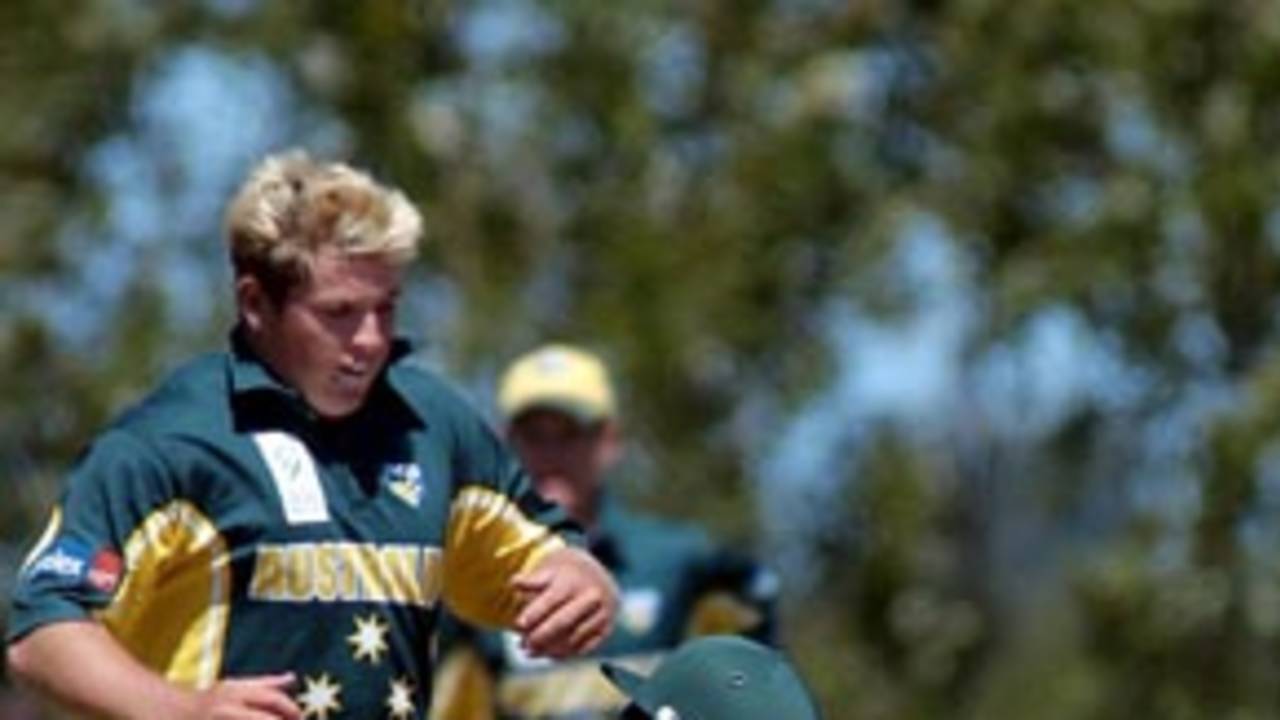 Homani makes contact with Cosgrove as he turns for a second run. ICC Under-19 World Cup Super League Final: Australia Under-19s v South Africa Under-19s at Lincoln, 9 Feb 2002